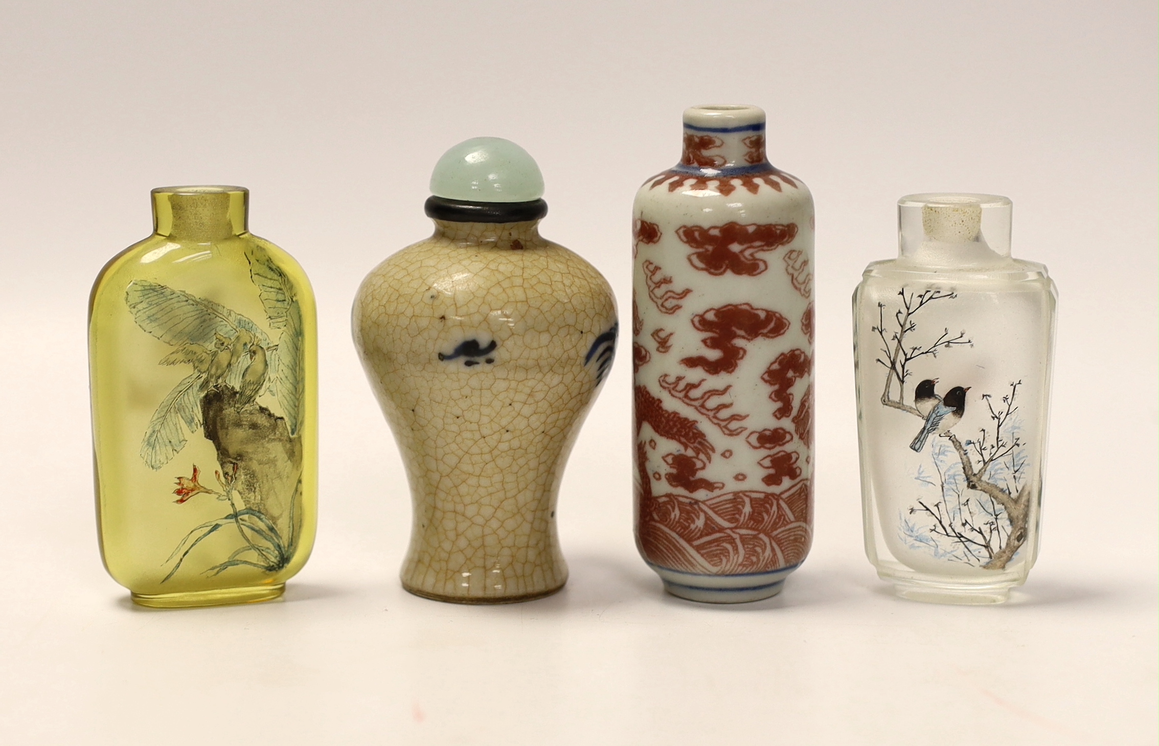 A Chinese crackle glaze snuff bottle, two inside painted glass snuff bottles and an underglaze copper red snuff bottle (4)